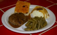 Hamburger Steak Dinner with green beans, mashed potatoes and gravy