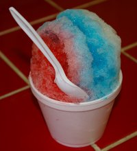 Rainbow Sno Biz shaved ice treat with blue raspberry, cherry and pina colada